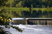 Tuckahoe Lake falls flowing from the mirror smooth lake over the spillway Tuckahoe Lake falls flowing from the mirror smooth lake over the spillway